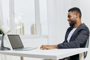 Business professional working on laptop at office desk