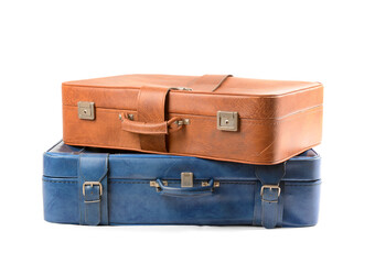 Brown and blue retro leather suitcases  on white background
