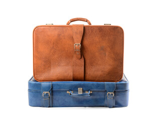 Brown and blue retro leather suitcases on white background