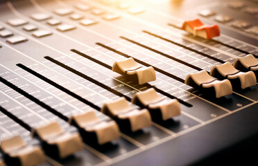 Mixing Desk Console – Professional Music audio recording mixing board. A row of console faders...