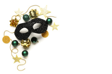 Naklejka premium Black carnival mask with Christmas decor on white background