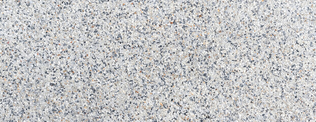 Close-up of terrazzo floor texture featuring mixed stone chips, ideal for architecture, flooring, and design projects