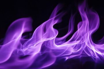 Obraz premium A mesmerizing display of purple flames, swirling and dancing against a dark backdrop, evoking a sense of mystery and energy.