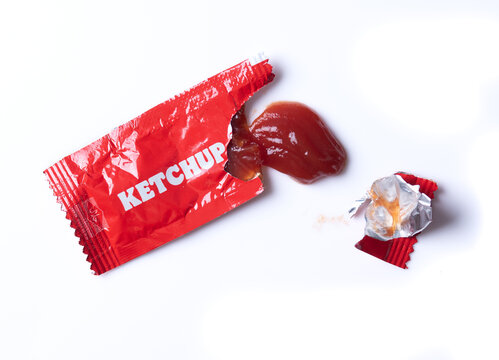 Tomato ketchup packet isolated on white background