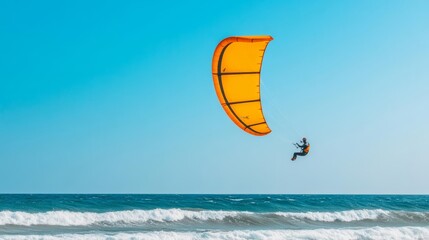 Kite surfer soaring high above ocean waves, harnessing wind power, capturing extreme sports thrill