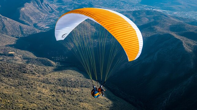 Paraglider gliding over a canyon, capturing freedom, adrenaline, and breathtaking heights