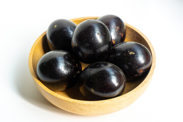 Grilled salted eggs on wooden bowl. Salted eggs are usually made from duck eggs fermented with ash and salt.