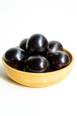 Grilled salted eggs on wooden bowl. Salted eggs are usually made from duck eggs fermented with ash and salt.