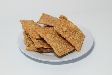 tempe or keripik tempe or kripik tempe. tempeh chips a typical Indonesian food made from soybeans and thinly sliced