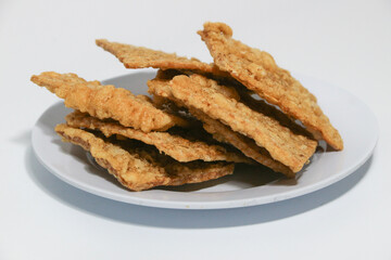 tempe or keripik tempe or kripik tempe. tempeh chips a typical Indonesian food made from soybeans and thinly sliced
