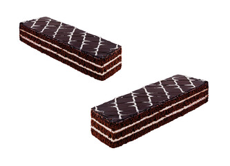 Two chocolate cake bars covered with chocolate icing laying on white background
