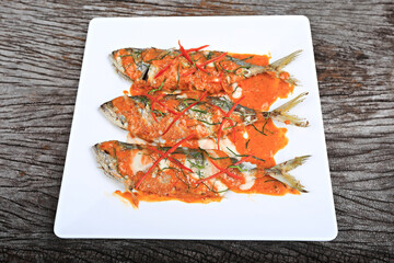 Fried mackerel with curry paste or Choo Chee mackerel. Thailand Food Style Background 