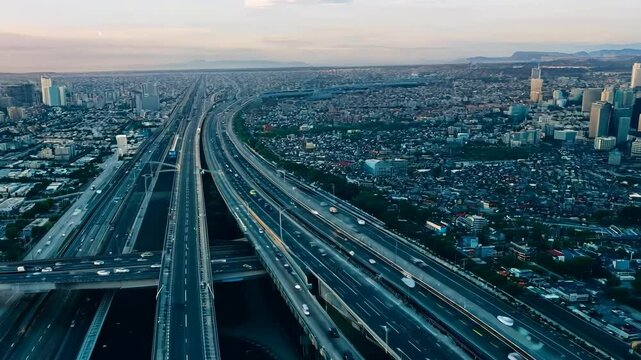 Expansive view of traffic flowing on Interstate 110 and 10 Highway in Los Angeles, California, capturing the dynamic pulse of urban life and mobility.