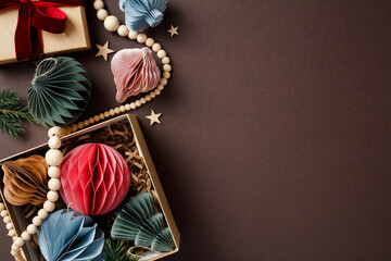 Christmas holiday decorations with colorful paper ornaments on brown background. Nordic style, hygge Xmas concept