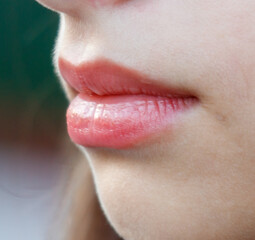 A woman's lips are painted red
