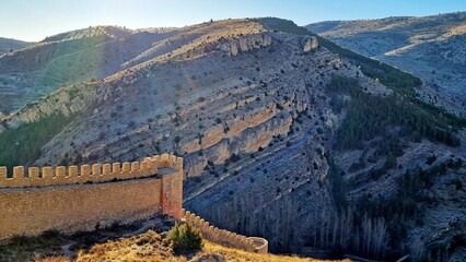 Castle wall Albarracín Teruel red stone beautiful village Spain sunrise rural tourism mountains...