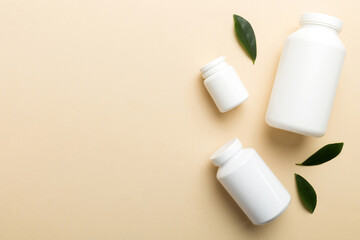 supplement pills with medicine bottle health care and medical top view. Vitamin tablets. Top view mockup bottle for pills and vitamins with green leaves, natural organic bio supplement, copy space