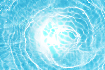 Blue water with ripples on the surface. Defocus blurred transparent blue colored clear calm water...