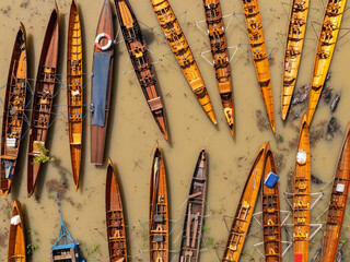The kayaks are tied together side by side on the water.