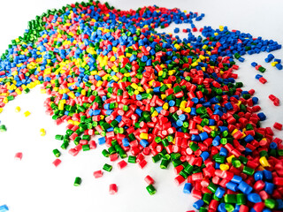 Obraz premium Colorful masterbatch granule, mix color polypropylene polymer granules, cold cutting type granule texture, isolated on white background, for industrial plastic company profile product catalog design