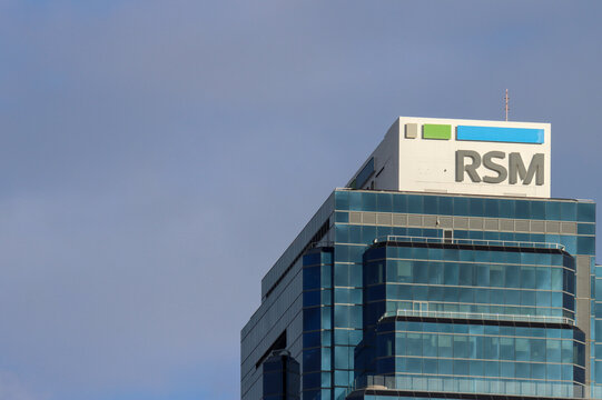 RSM Australia, Perth, Western Australia. Audit, tax, and consulting. Brand name against side of building exterior. Copy space.