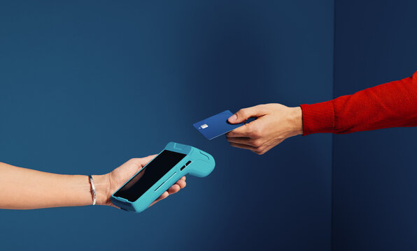 Tap to pay with bank card using cashless payment technology - Powered by Adobe