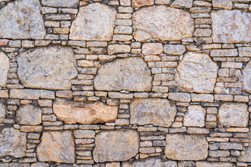 Closeup view of ancient dry stone wall, Taxila, Punjab, Pakistan - textured background
