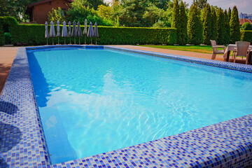 large swimming pool. ripples on the blue water in the pool. water purification in swimming pools. Relaxing in the water.