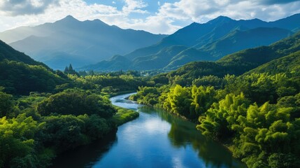 Stunning view of the Azusa River winding through the lush greenery of KamikAchi, with the Hotaka Mountains towering in the background, creating a serene and scenic landscape.