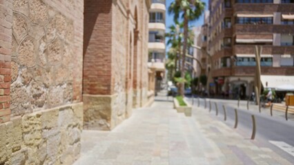 Blurred street view with historic brick building, modern apartments, and palm trees creating a vibrant urban environment in the sunny outdoors