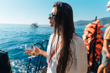 Fototapeta premium Enjoy a Serene Yacht Experience while savoring a Refreshing Beverage on the water