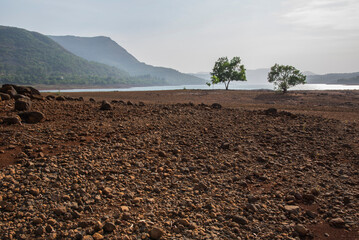 Tranquil rural landscape scenery, Red soil landscape, Amazing Summer landscape, Idyllic nature view on a hot summer day, Mulshi, Pune, Maharashtra, India. Background, Cover, Wallpaper, Copy space