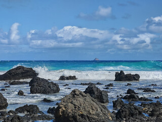 Caleta del Mojon beach with white sand and volcanic rocks in Lanzarote, Spain