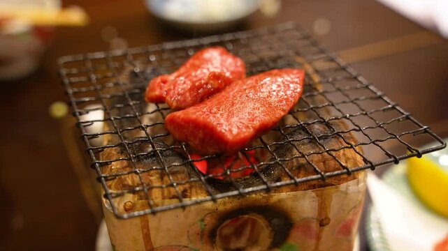 grilling an a5 Hida beef on a small clay stone