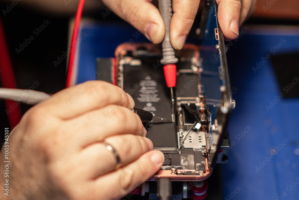 Aufkleber Repairing a smartphone battery with precision tools to ensure optimal performance during a busy afternoon at a tech repair shop