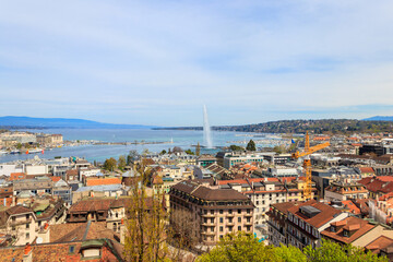 Panoramic view of city of Geneva, Lake Geneva and Jet d'Eau fountain in Switzerland. View from the bell tower of Saint Pierre Cathedral