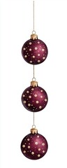 Obraz premium Three elegant purple Christmas ornaments hanging in a row.