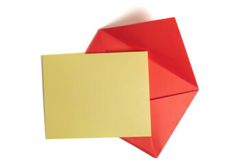 Plain yellow card on a vibrant red envelope for personal messages, invitations. Top view