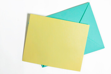 Colorful Envelopes and Blank Card on White Background, perfect for invitations or greetings. Top view