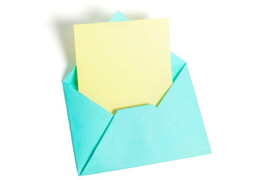 Top view of open blue envelope with yellow paper sheet isolated on white background.