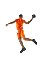 Young athletic woman, handball player in orange uniform in motion, throwing ball, playing isolated on white background. Concept of sport, active and healthy lifestyle, hobby