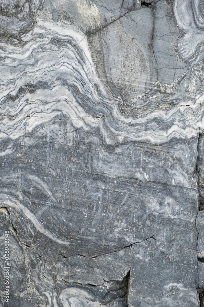 Poster a detailed view of a marble surface exhibiting beautiful grey and white swirls, highlighting unique 