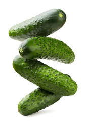 Cucumbers levitation close-up on a white. Isolated
