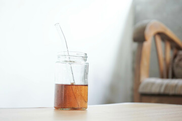 A glass of tea is placed on the table isolated on a white background