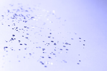 Blue blurred background with glitter confetti, pastel color