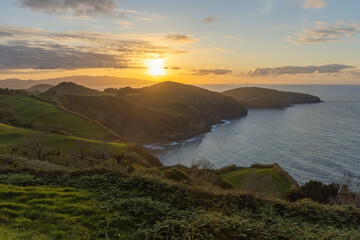 Breathtaking view of the cliff Atlantic ocean coat at sunset Azores islands Portugal