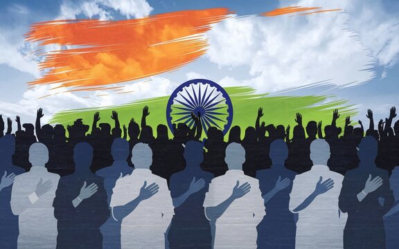 A crowd of people silhouetted against the Indian flag.