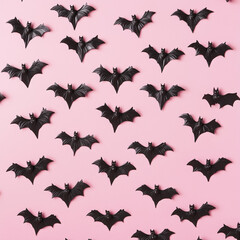 Fototapeta premium Creative pink pattern made of bats. Minimal flat lay. Halloween concept.