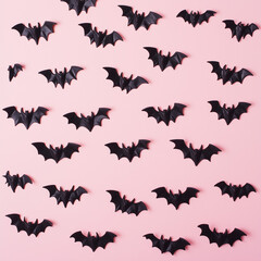 Creative pink pattern made of bats. Minimal flat lay. Halloween concept.