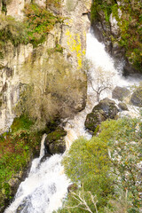 waterfall with a lot of water due to the autumn rains